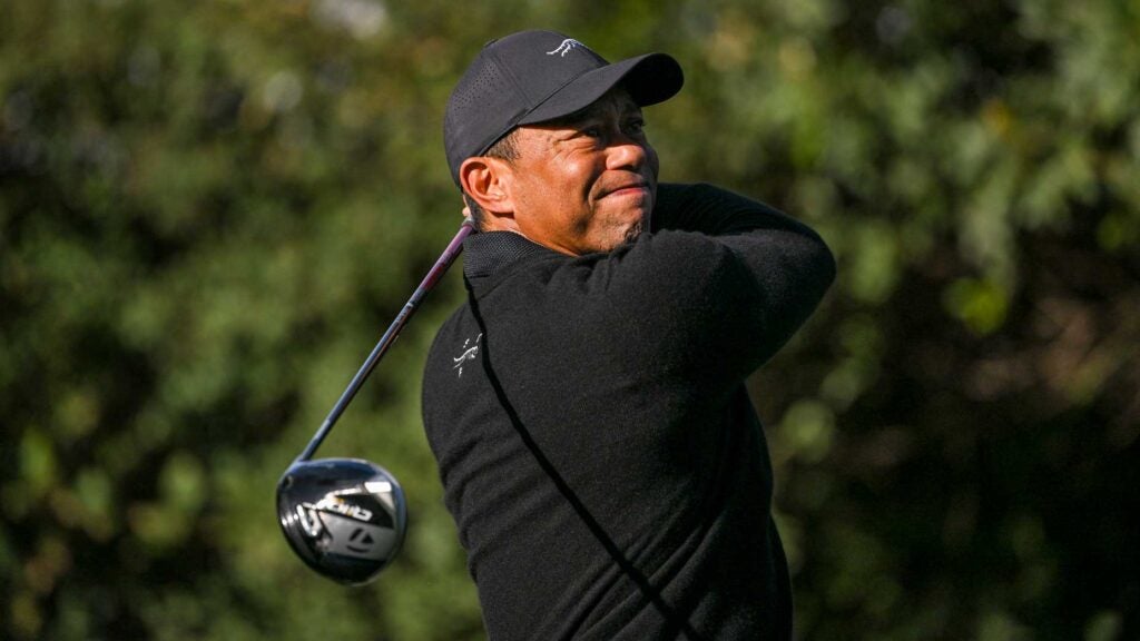 Tiger Woods watches shot after hitting a drive during practice round at 2024 Genesis Invitational