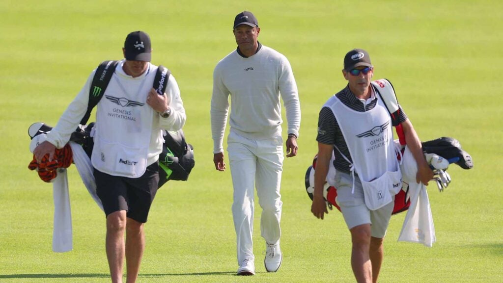 Tiger Woods walks with his caddie at 2024 Genesis Invitational