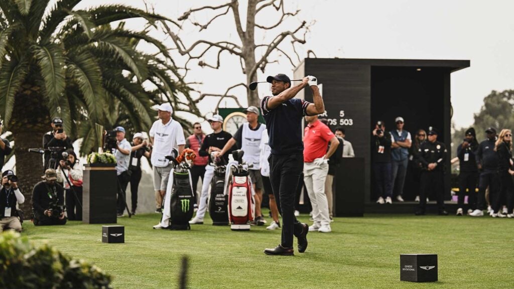 tiger woods swings driver at genesis invitational in striped shirt