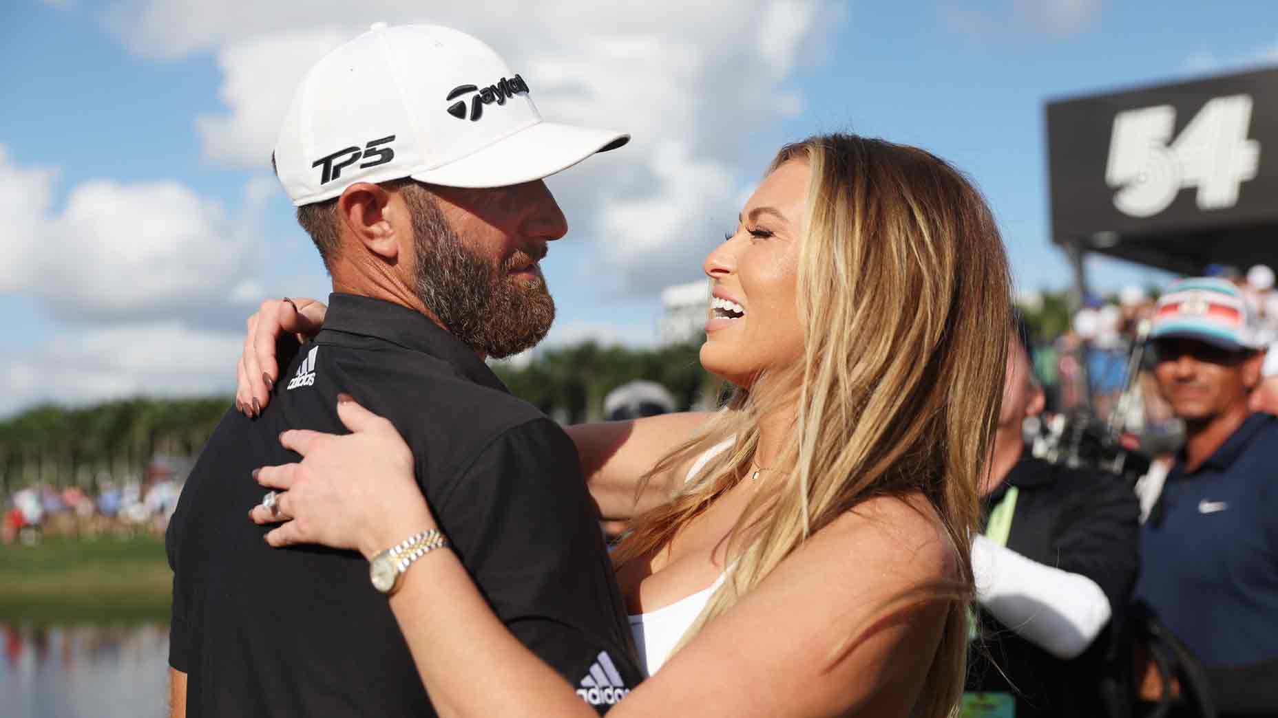 Team Captain Dustin Johnson of 4 Aces GC and wife Paulina Gretzky celebrate the 4 Aces GC team win on the 18th green during the team championship stroke-play round of the LIV Golf Invitational - Miami at Trump National Doral Miami on October 30, 2022 in Doral, Florida.