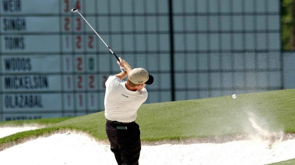 Jeff Maggert of the US hits out of the bunker on the third hole during the final round of the Masters Golf tournament 13 April, 2003 at the Augusta National Golf Club in Augusta, Georgia. Maggert's ball hit the front lip and bounced back and hit Maggert in the chest for a two stroke penalty, as a result Maggert had a triple bogie in the hole.