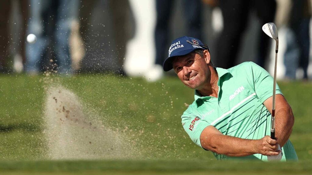 Padraig Harrington of Ireland hits out of the bunker on the 18th hole to take the lead during the second round of the Hoag Classic Newport Beach at Newport Beach Country Club on March 23, 2024 in Newport Beach, California.