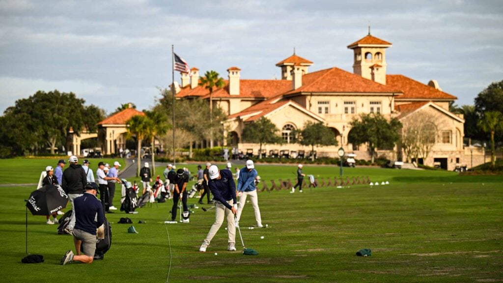 Players warm up at the TPC Sawgrass range.