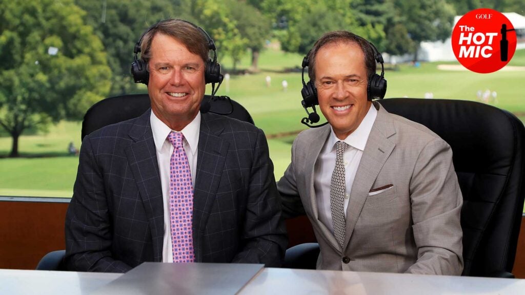 paul azinger and dan hicks smile at NBC booth in suits
