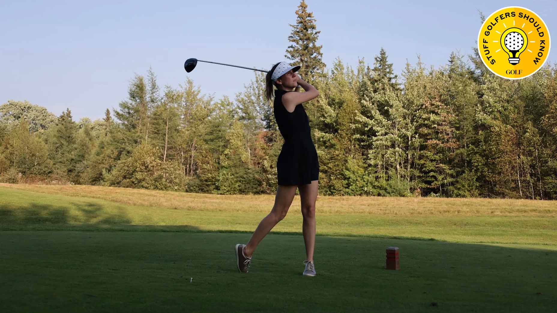 woman teeing off golf PEI