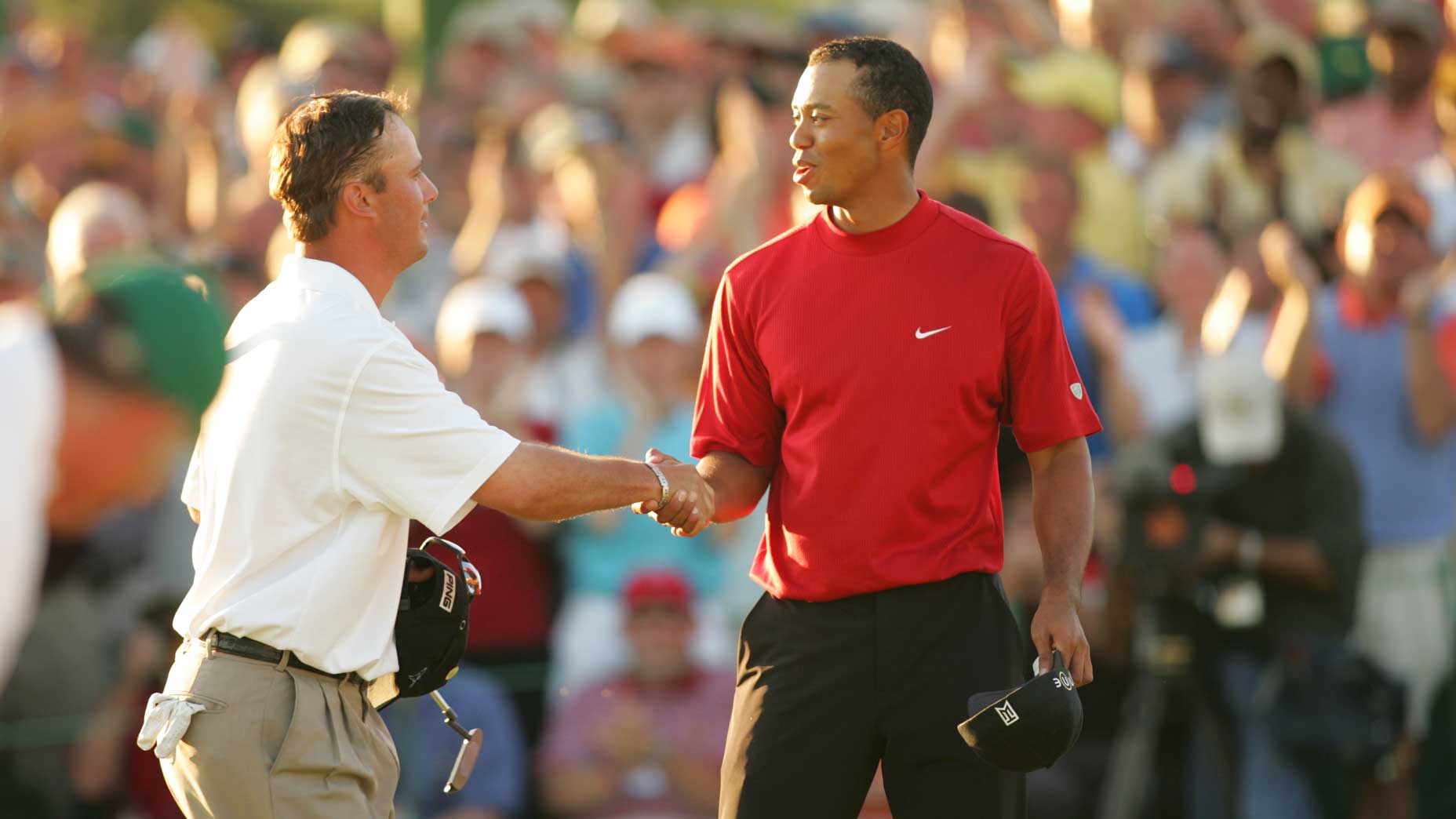 Chris DiMarco and Tiger Woods shake hands at the 2005 Masters.