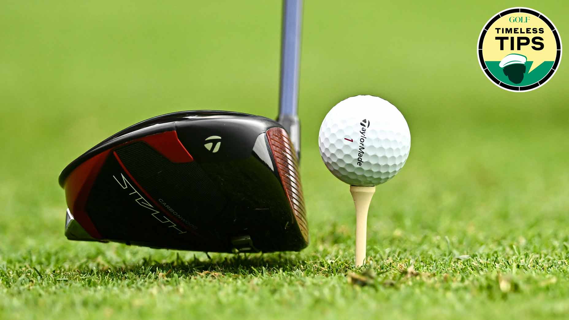 taylormade golf ball sits on tee with taylormade driver hovering behind it