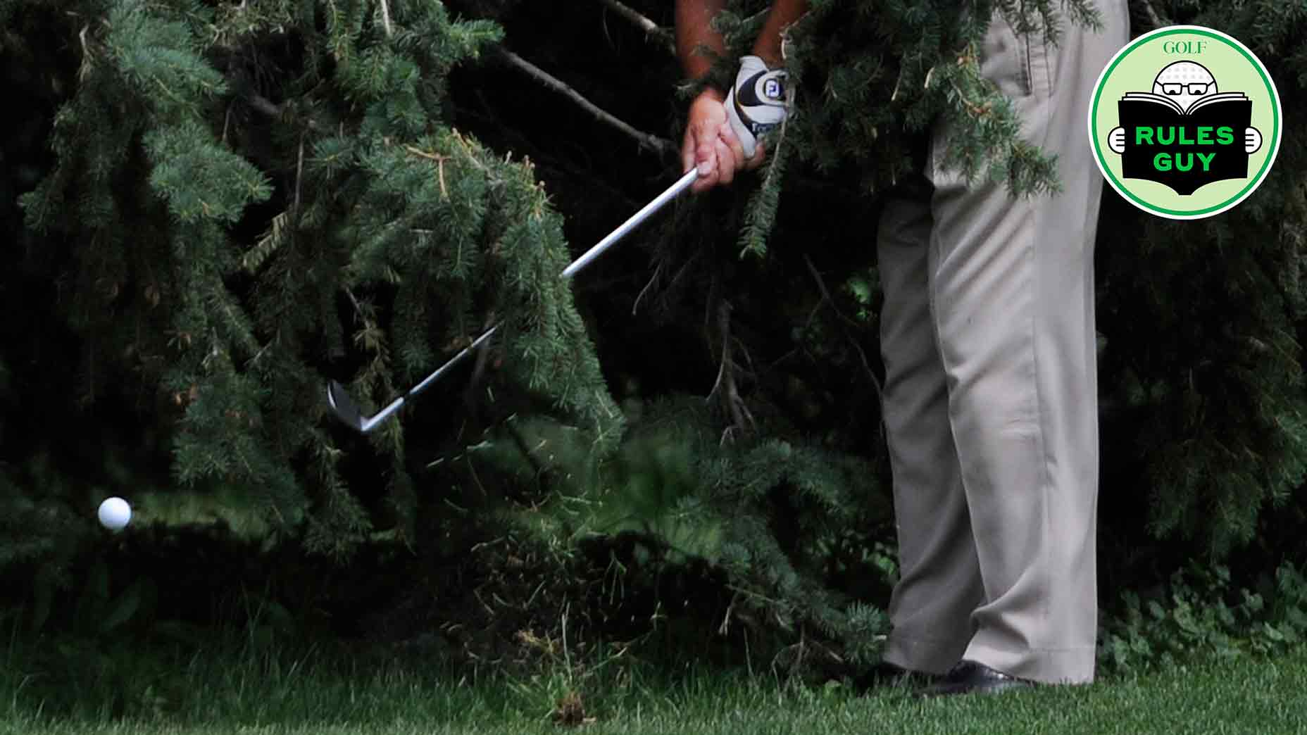Professional golfer, Doug Perry, Ft. Collins Colorado, chips out from underneath the branches of a very large pine tree on the 9th fairway during the U.S. Senior Open Sectional Qualifying at Rolling Hills Country Club in Golden Thursday morning.