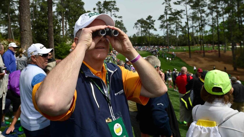 a masters patron looks on