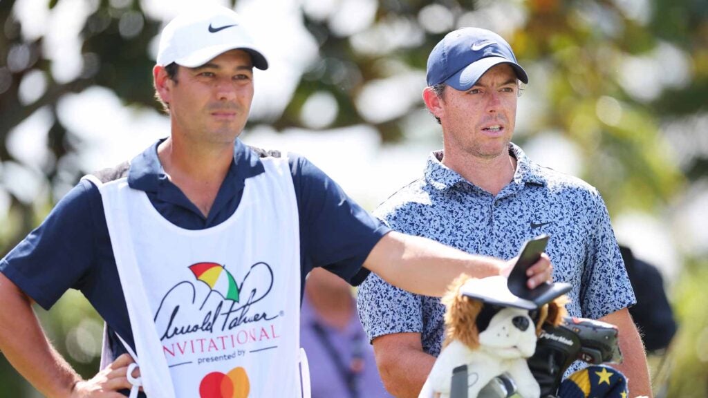 Rory McIlroy stands next to caddie at 2023 Arnold Palmer Invitational