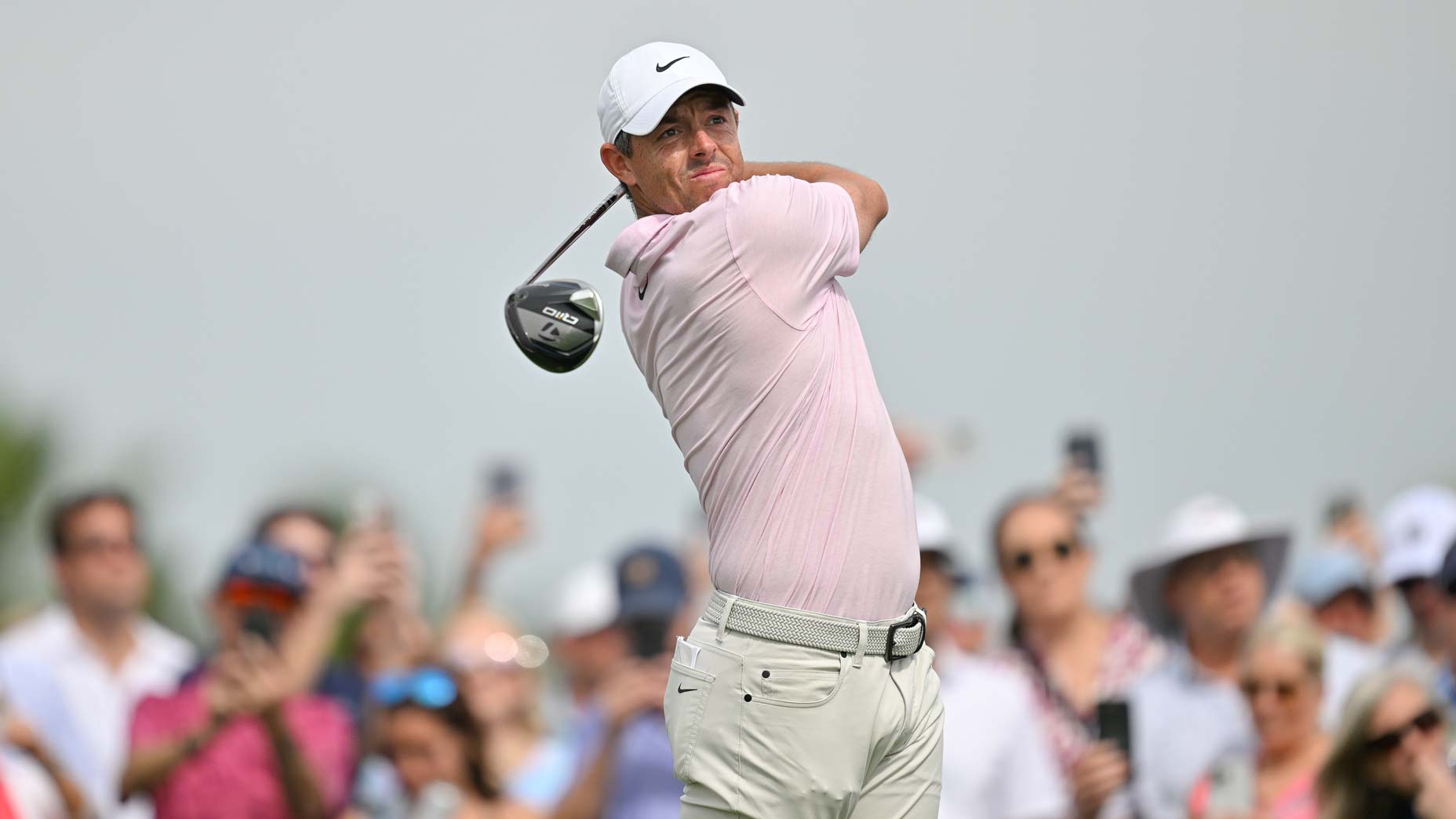 Rory McIlroy in pink shirt hits drive at 2024 Cognizant Classic