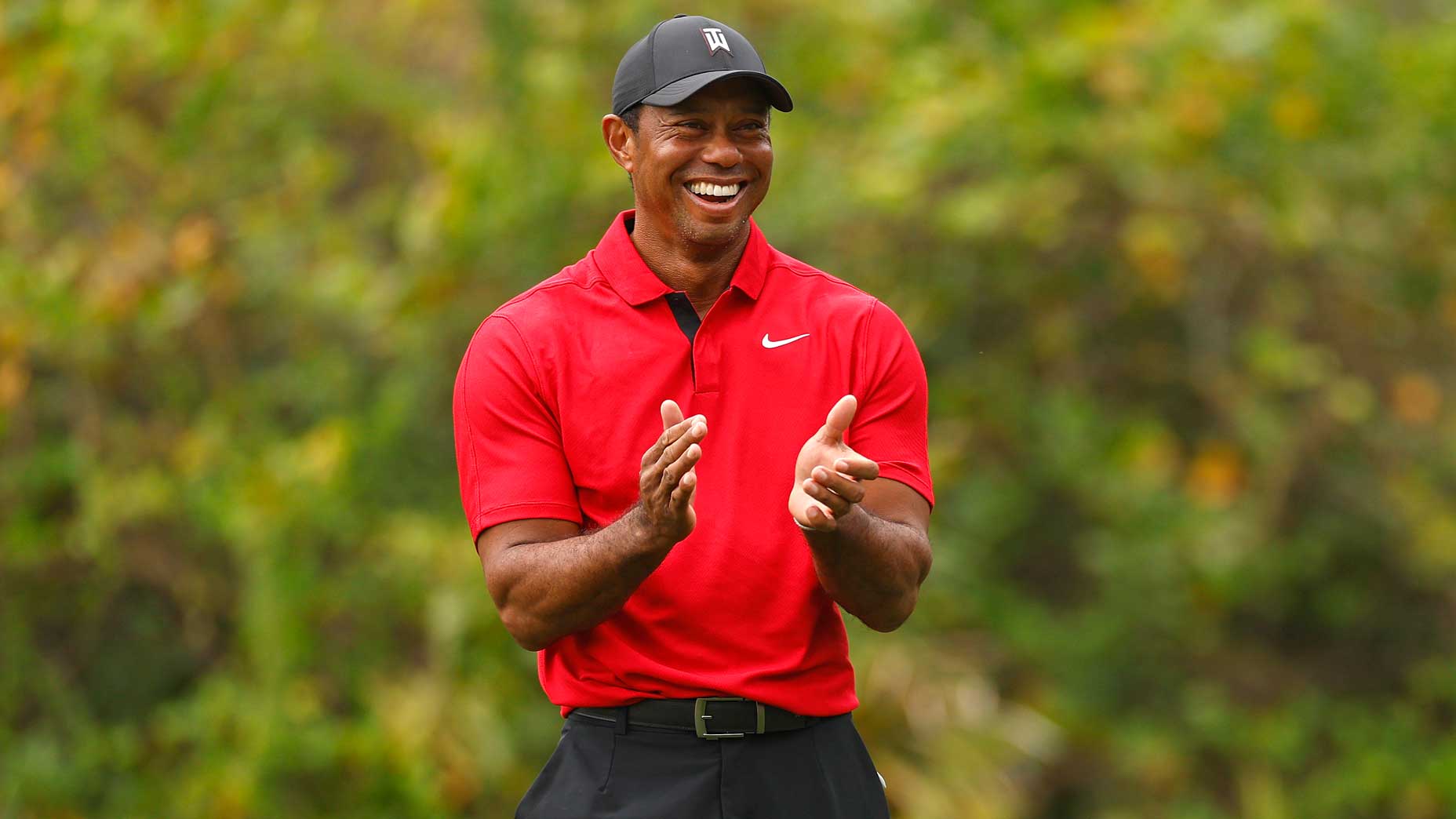 Tiger Woods smiles and claps during 2024 PNC Championship
