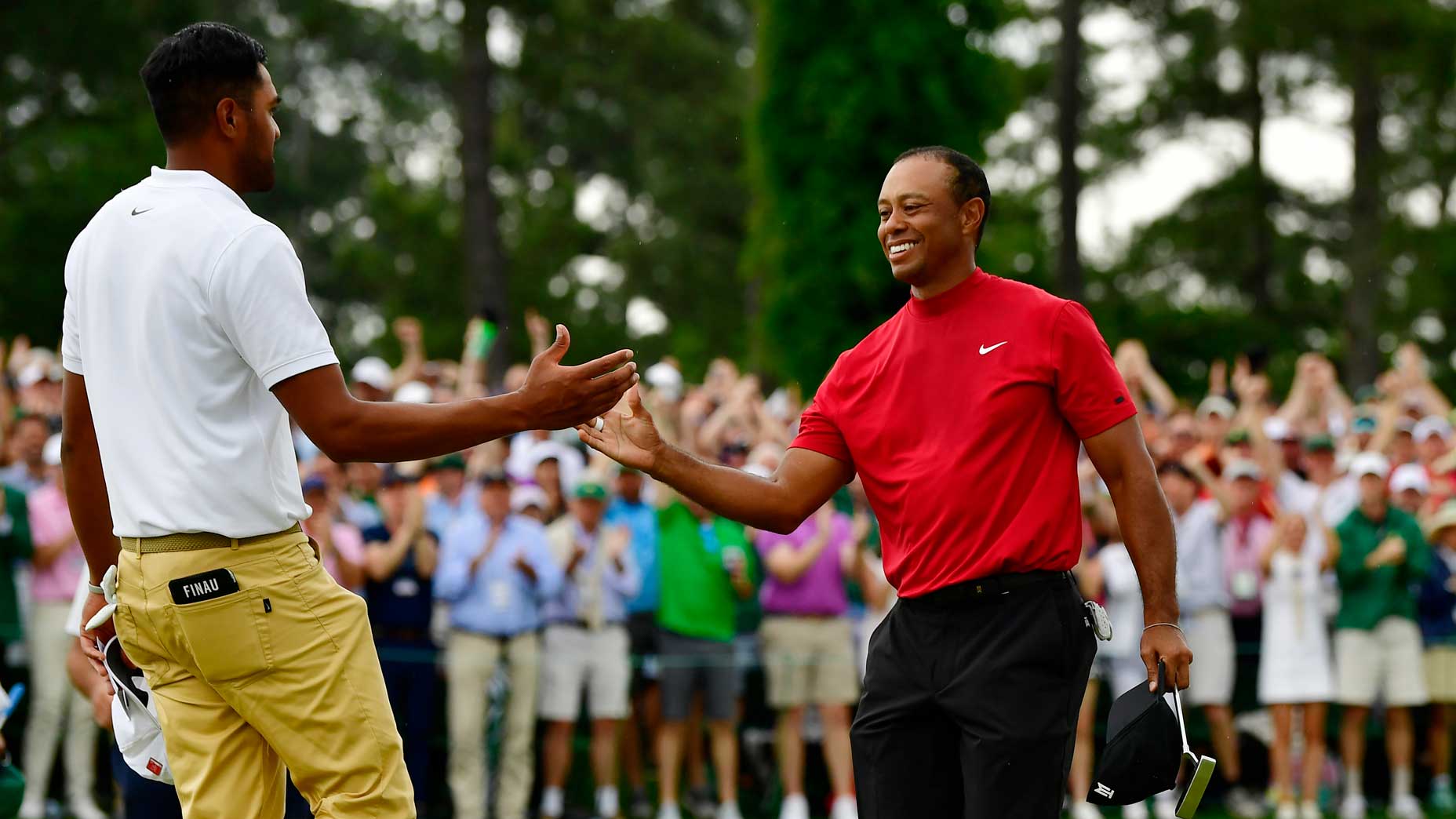 Tiger Woods and Tony Finau shake hands after the 2019 Masters.