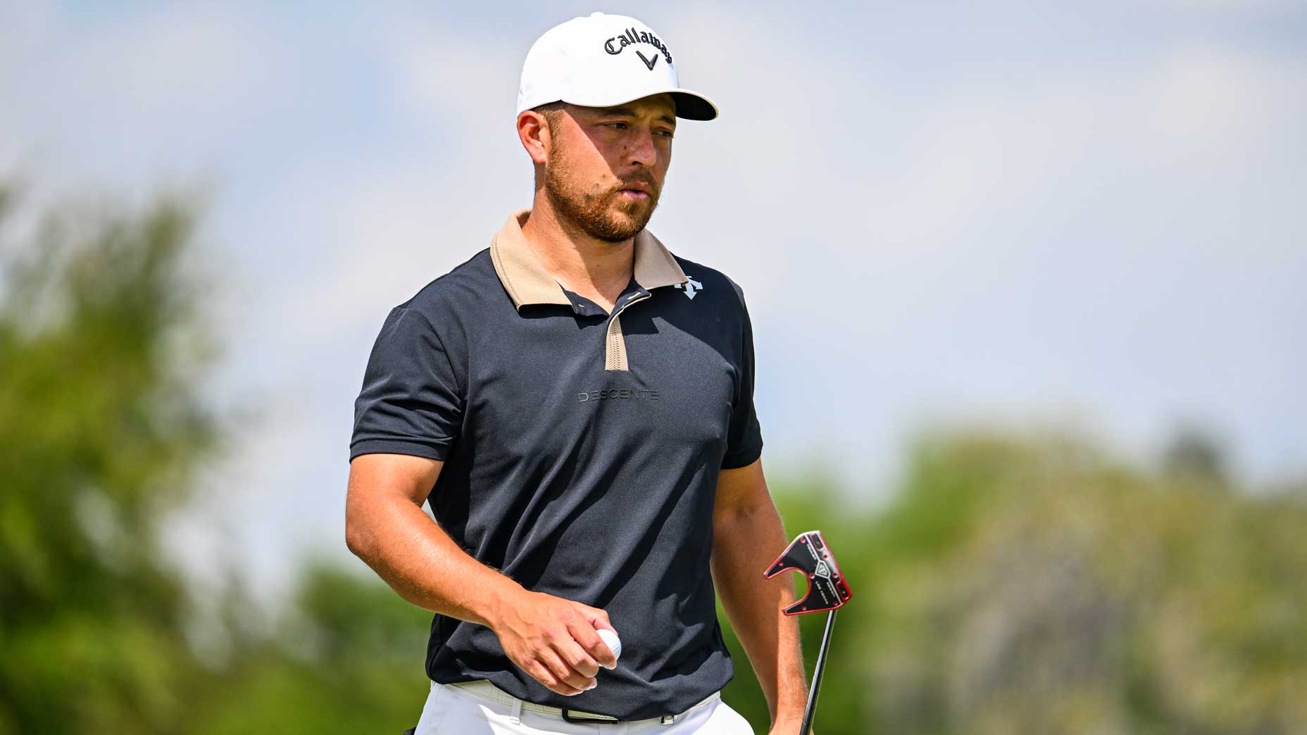 PGA Tour pro Xander Schauffele walks off green during 2024 Arnold Palmer Invitational