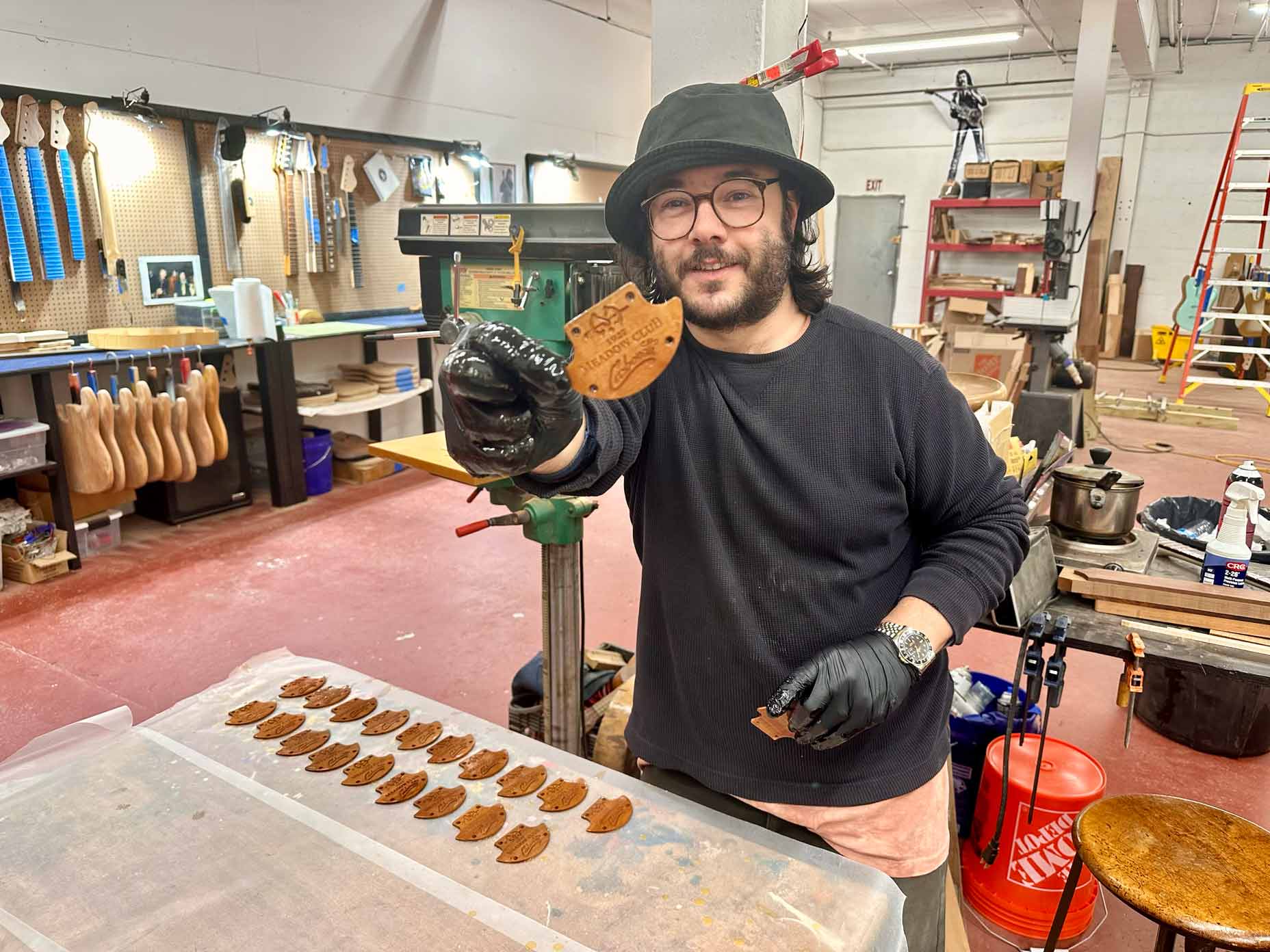 Jimmy Carbonetti shows the plates he created for a limited run with Toulon Golf.