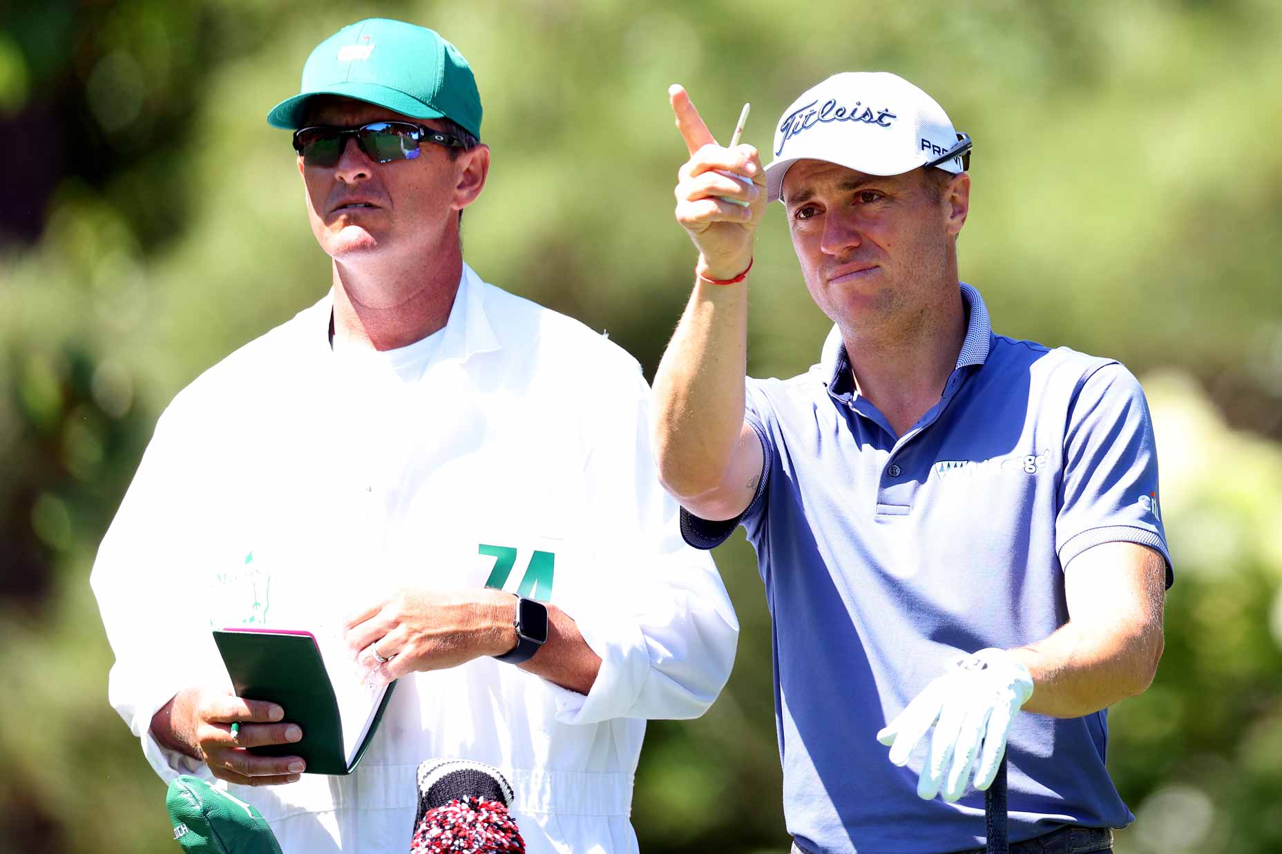 Justin Thomas points with new caddie Matt Minister.