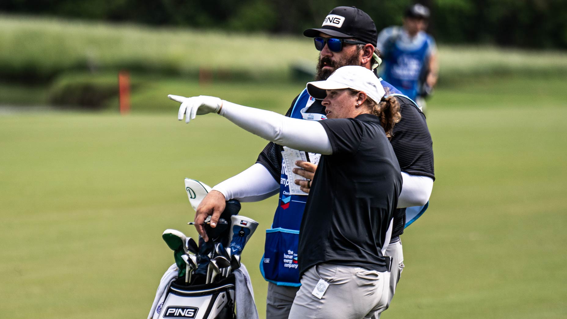 Lauren Coughlin talks with her caddie at the Chevron Championship.