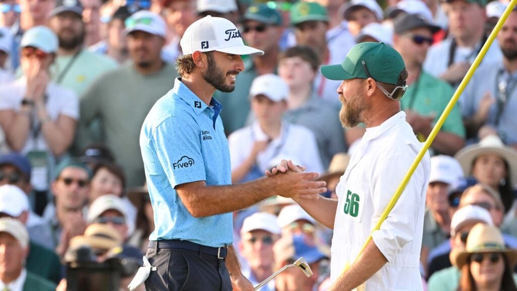 Max Homa shakes hands with his caddie at the end of the Masters.