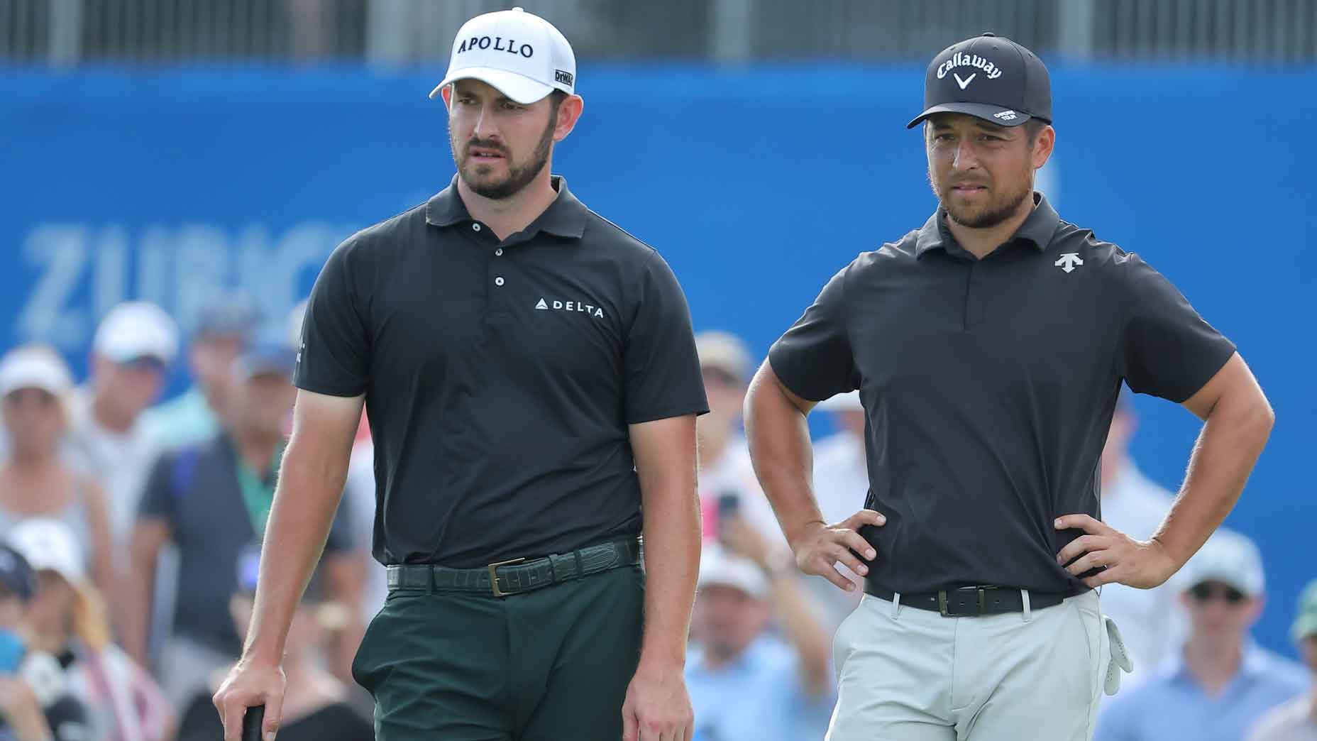 Patrick Cantlay of the United States and Xander Schauffele of the United States speak on the 18th green during the second round of the Zurich Classic of New Orleans at TPC Louisiana on April 26, 2024 in Avondale, Louisiana