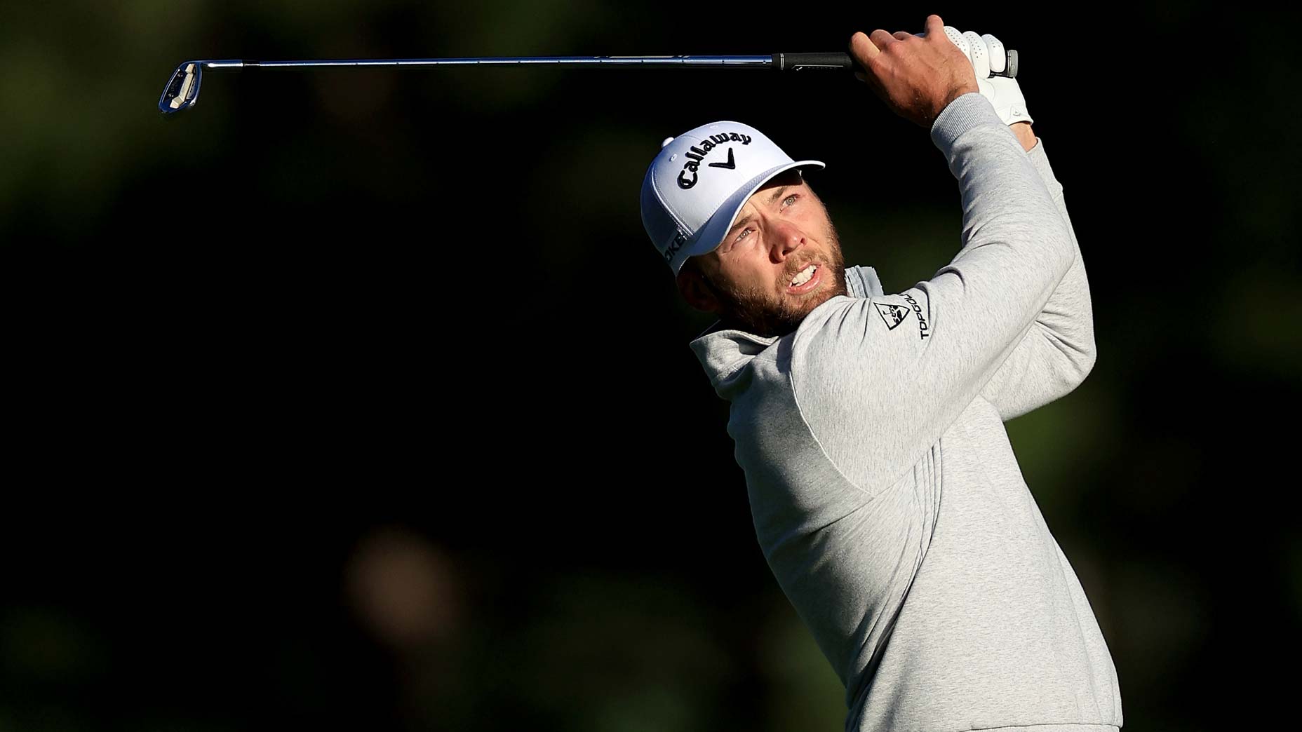 Sam Burns watches a shot at the Masters.