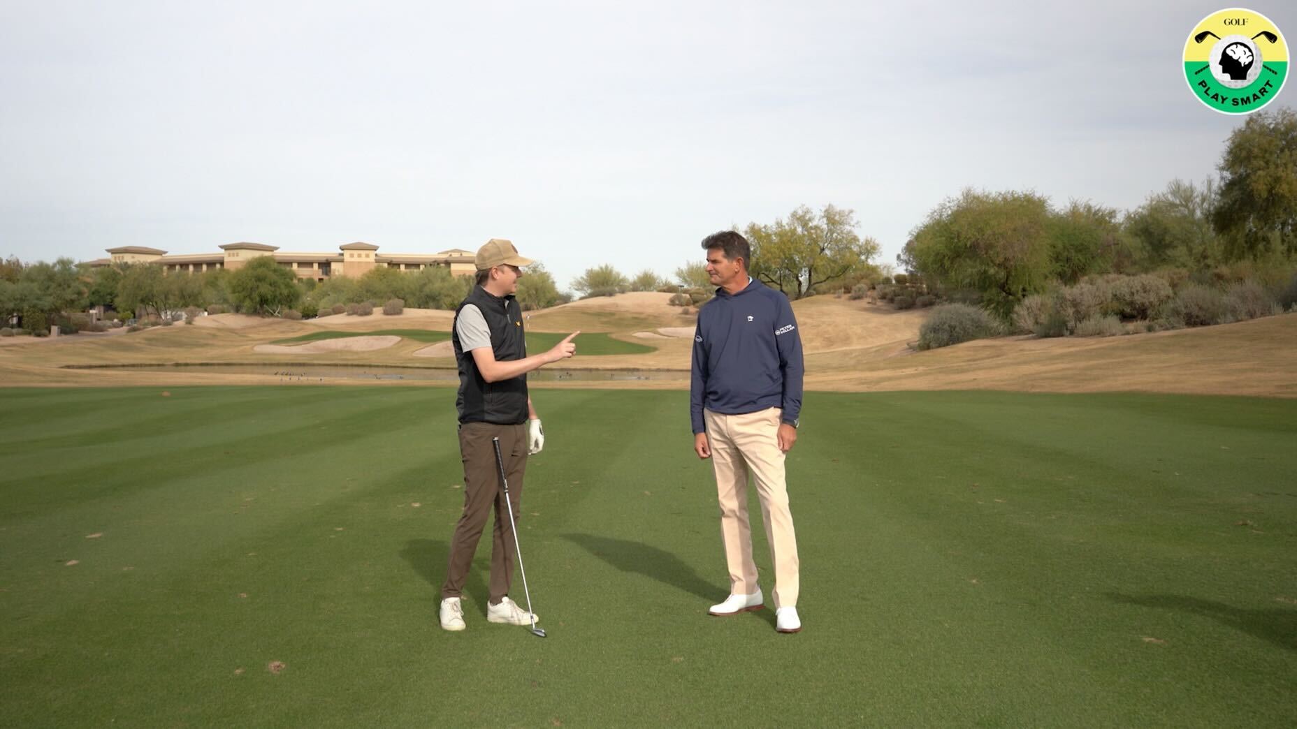 GOLF editor zephyr melton talks with jason baile standing in the middle of a fairway