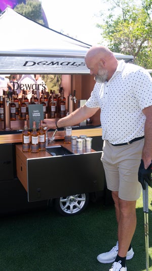 Andrew Whitworth checking out the Dewar's bar cart at the 8 am Invitational