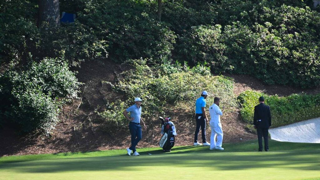 max homa searches for his ball in the bushes during the final round of the 2024 masters