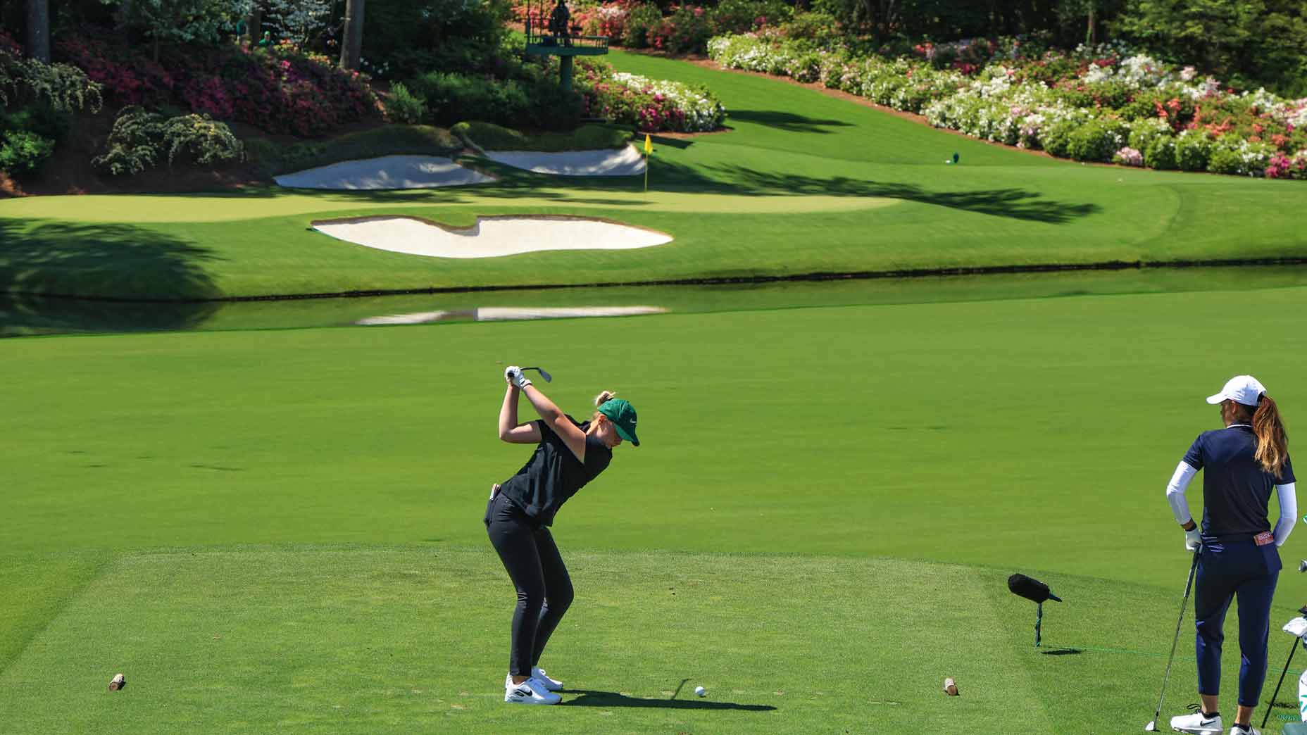 bailey shoemaker tees off on the par-3 13th at Augusta National