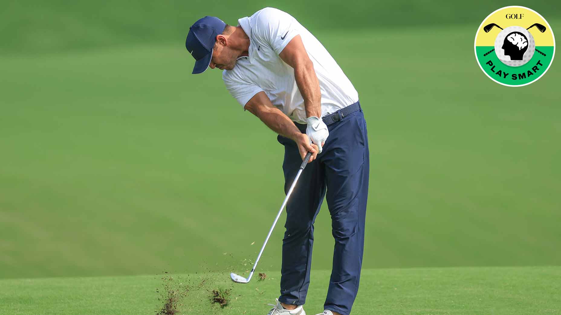 brooks koepka swings and makes a divot during the 2022 pga championship