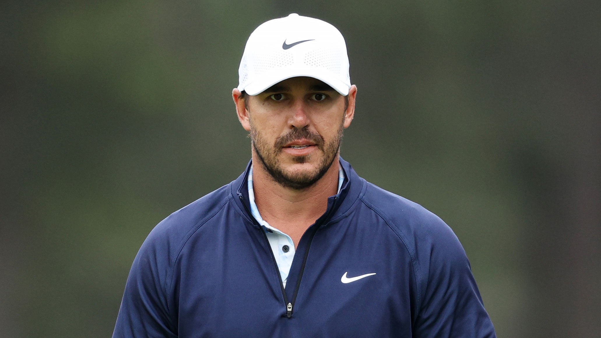 Brooks Koepka of the United States seen on the eighth green during a practice round prior to the 2024 Masters