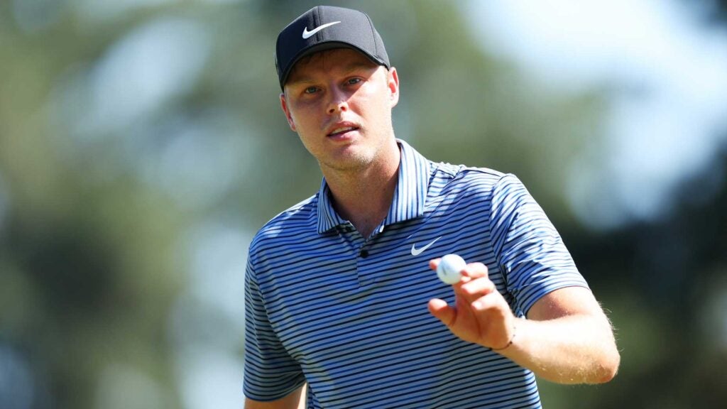 Tour pro Cam Davis gestures to crowd at 2024 Masters