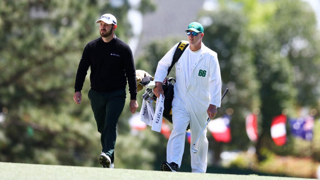 Patrick Cantlay of the United States walks across the first hole during the third round of the 2024 Masters Tournament at Augusta National Golf Club