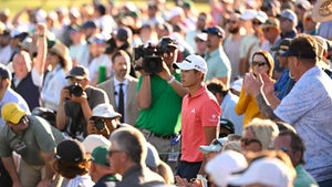 Collin Morikawa walks up to the 18th green during the third round of the Masters on Saturday at Augusta National Golf Club.