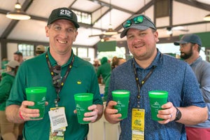 patrons hold the crow's nest beer at augusta national