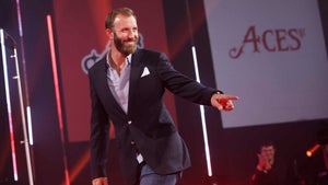 Dustin Johnson walks across stage