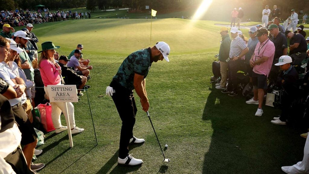 Dustin johnson hits a putt at the 2024 masters