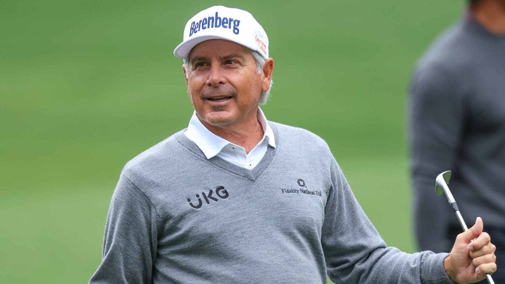 Fred Couples holds golf club during 2024 Masters at Augusta National