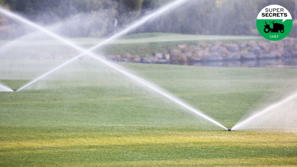 A golf course being watered.