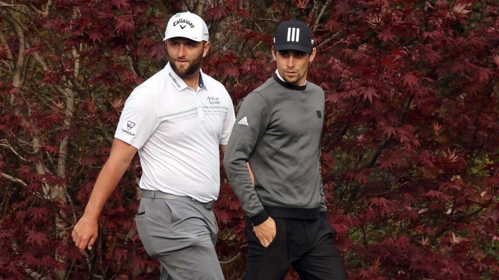 LIV pros Jon Rahm and Joaquin Niemann walk during practice round at 2022 Masters