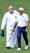 Jose Andres and Sergio Garcia walk at the Masters Par-3 Contest.