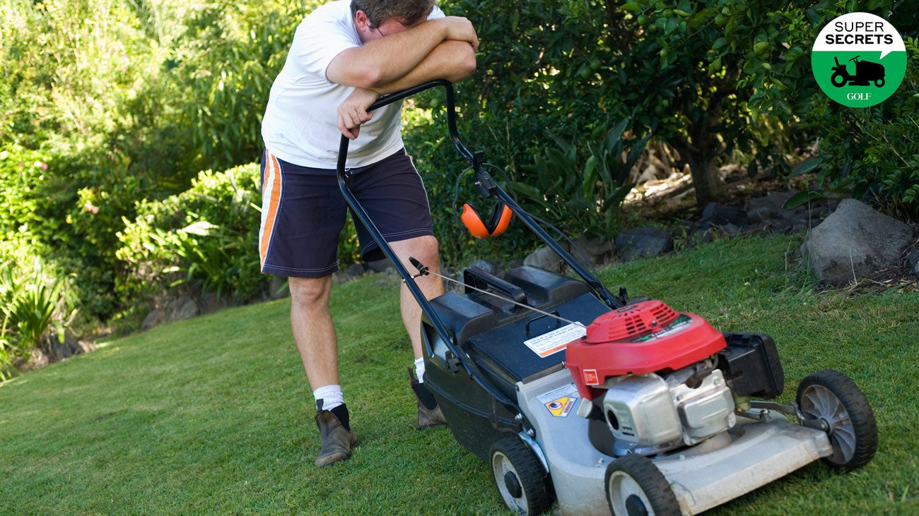 A frustrated man mowing a lawn