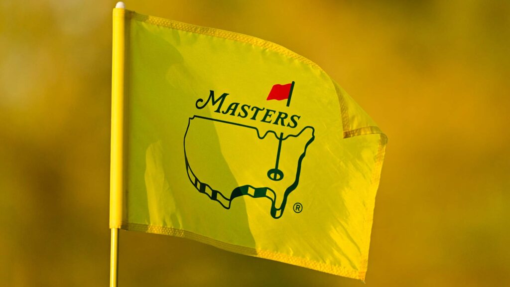 Masters flag pictured against yellow background at Augusta National