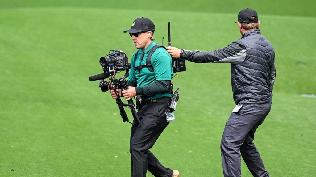 A CBS cameraman an assistant film the 2023 Masters at Augusta National.