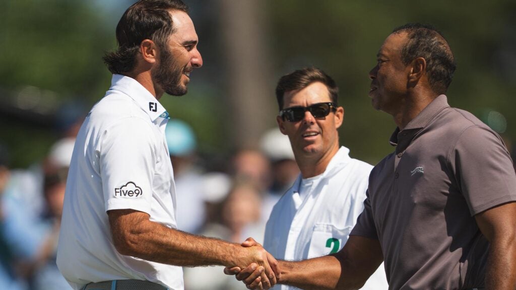 max homa and tiger woods shake hands at the Masters on Friday