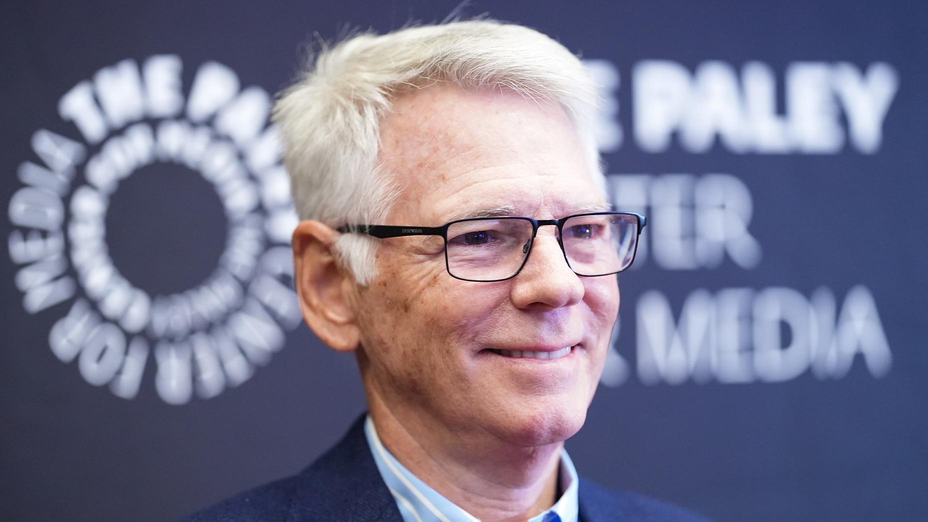 sean mcmanus smiles at a paley center event.