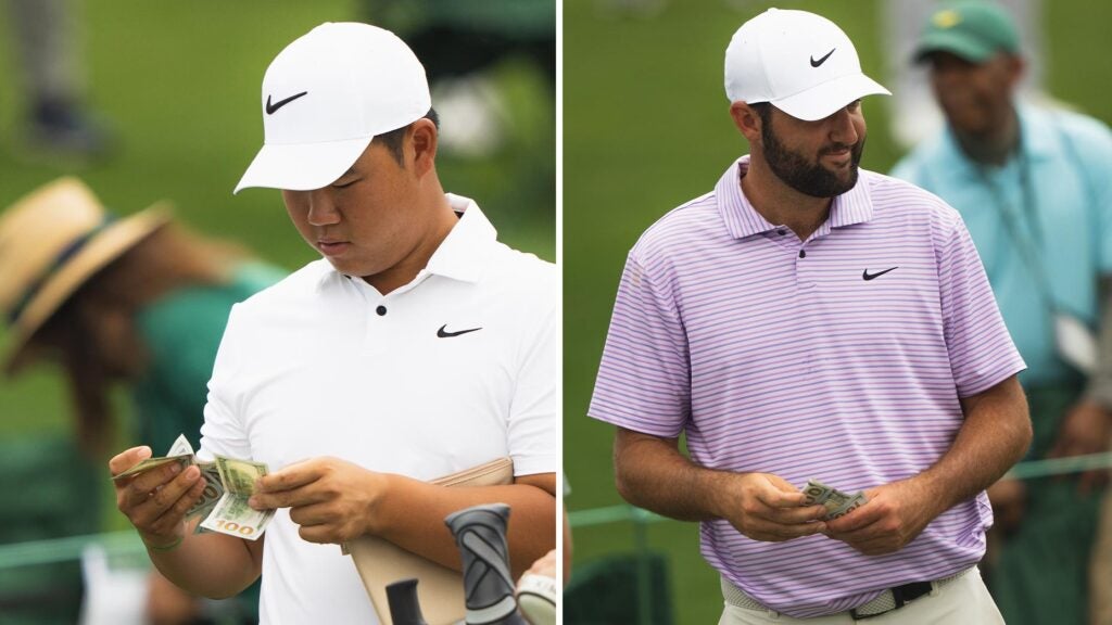 Tom Kim and Scottie Scheffler hold money at the Masters