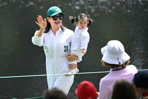 Byeong Hun An of South Korea's wife, Jamie Hee-Jae An, walks with their daughter, An Ji-woo, during the Par-3 Contest, prior to Masters Tournament at Augusta National Golf Club on April 10, 2024 in Augusta, Georgia.