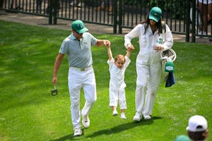 Rickie Fowler with his wife, Allison Stokke, swing their daughter, Maya,