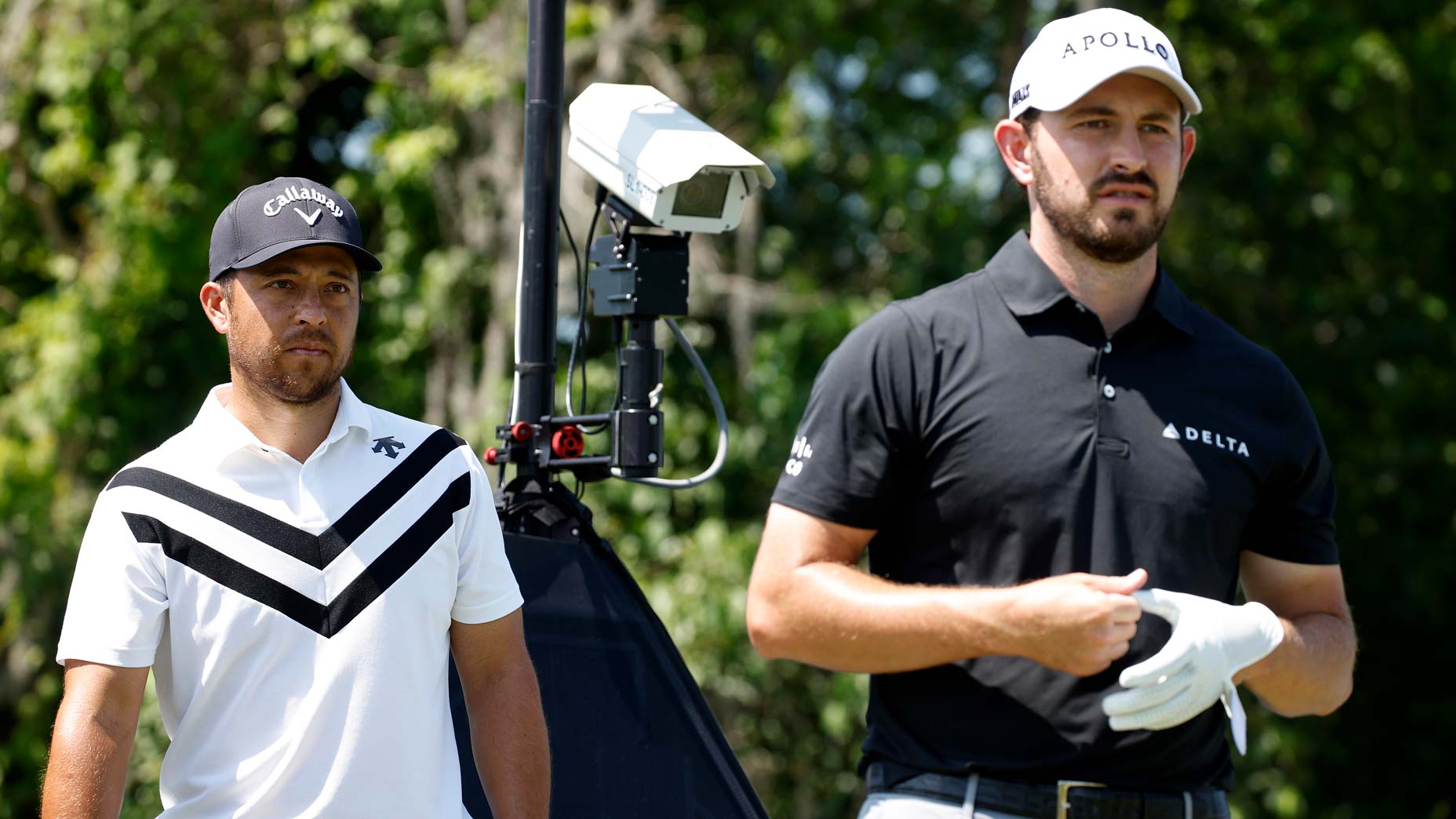 Pro golfers Xander Schauffele and Patrick Cantlay walk and talk during 2024 Zurich Classic of New Orleans