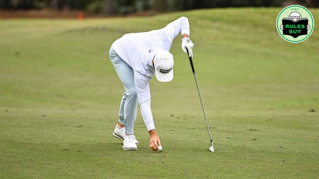 Tano Goya of Argentina places his ball back on the first hole fairway with preferred lies (lift clean place) in effect during the first round of the PGA TOUR Q-School presented by Korn Ferry tournament on the Dye's Valley Golf Course at TPC Sawgrass on December 14, 2023 in Ponte Vedra Beach, Florida.